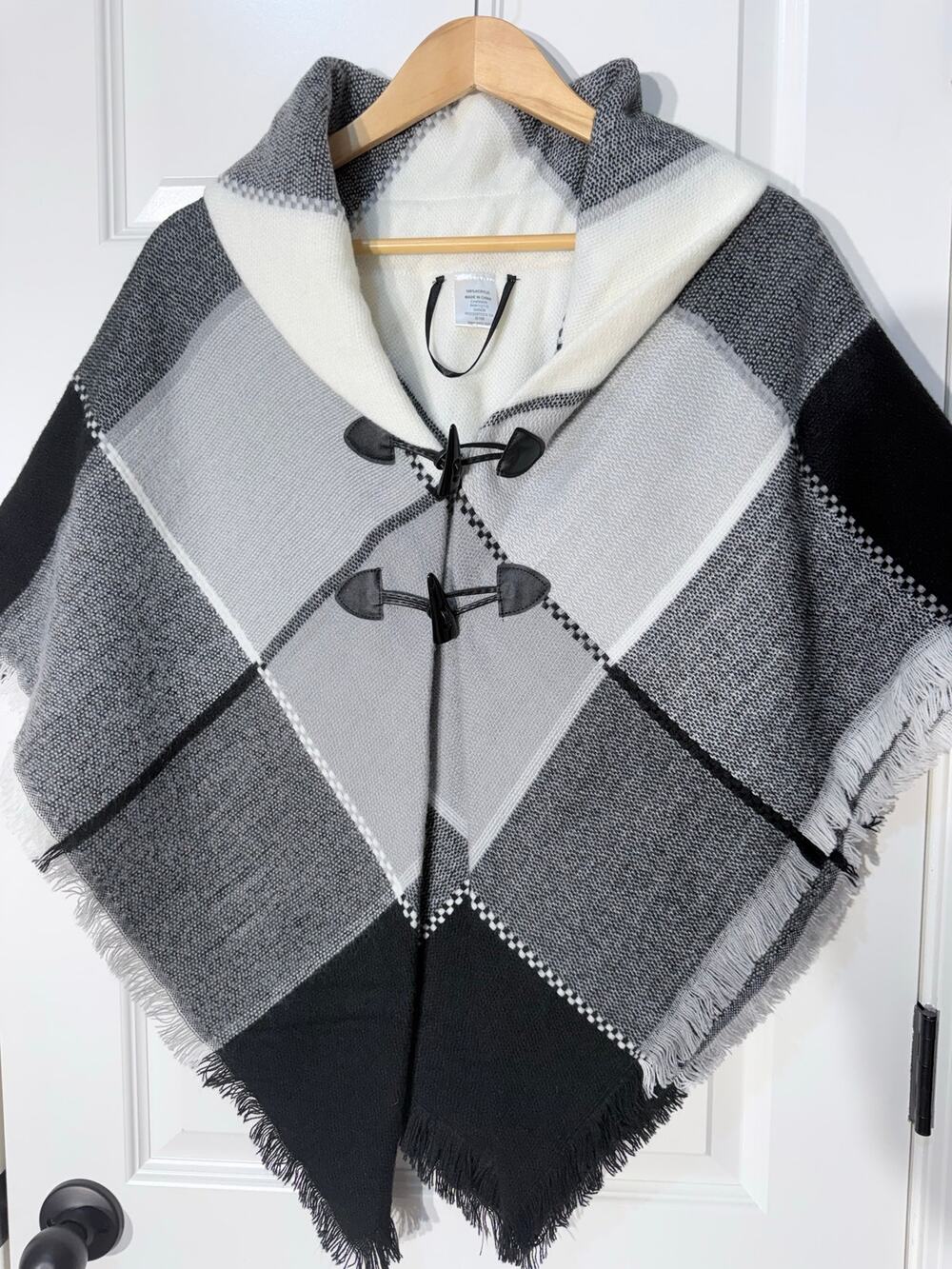 Black, Ivory, Gray Plaid Poncho with Toggle Button Closure and Fringe Trim